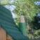 Green and wooden roof detail of Nill's Playhouse.