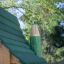 Green and wooden roof detail of Nill's Playhouse.