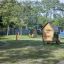 Playground featuring Olle's Playhouse wooden structures.