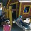Children playing on Olle's Playhouse in a playground.