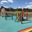 Lisa's Playhouse with slide on colorful playground