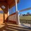 Lisa's Playhouse with slide, wooden playhouse with slide in a park setting.